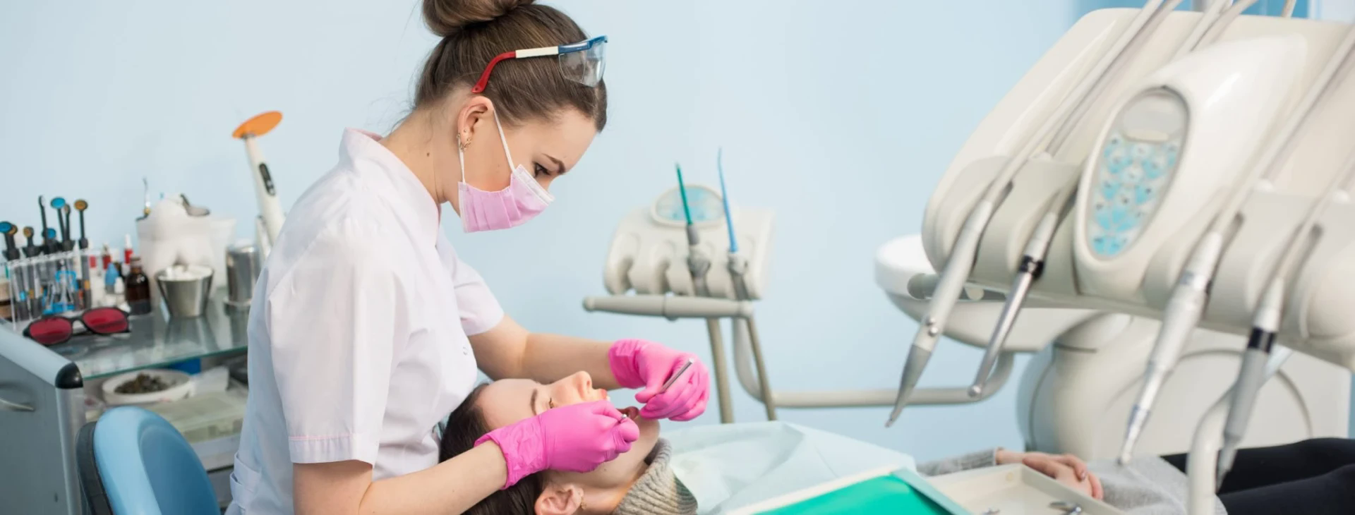 Dental clinician working with modern speciality treatment equipment